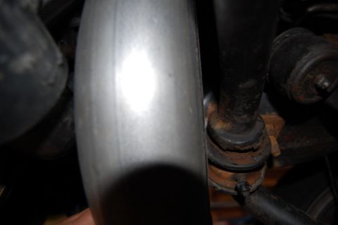 1985 Mercury Grand Marquis - Detail shot of exhaust pipe and suspension components, with visible rust on the suspension parts.