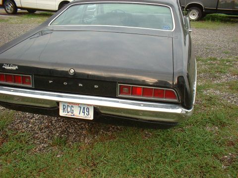 1970 Ford Falcon - Rear view of a black 1970 Ford Falcon showing its taillights and chrome bumper.
