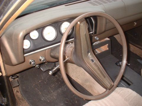 1970 Ford Falcon - Interior view of a 1970 Ford Falcon, the dashboard, steering wheel, and pedals.