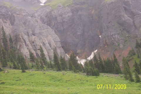 1996 Ford Bronco - A vast mountain scene with terrain and sparse vegetation, devoid of any vehicles.