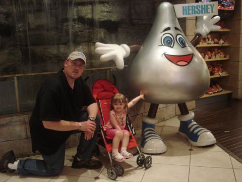 2000 Ford Crown Victoria - A family visits a Hershey's store and poses with a giant Hershey's Kiss mascot.