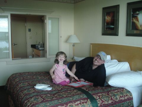 2000 Ford Crown Victoria - Mia enjoying drawing on the big bed in our hotel room. She really liked jumping on it.