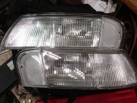 1993 Ford Taurus - A pair of clear corner headlights are shown, likely for a vehicle.