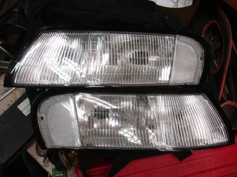 1993 Ford Taurus - Two clear corner headlights are shown, likely for a car's front end.