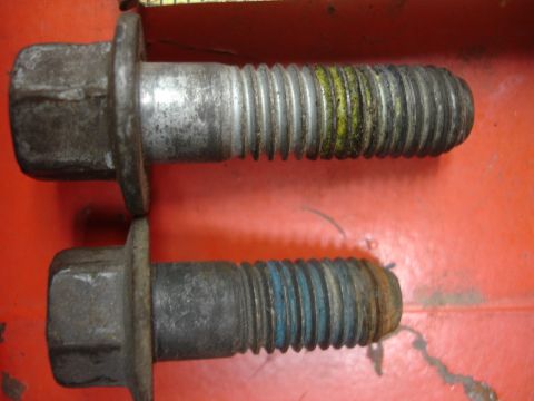 1990 Ford Taurus - Bolts with different colored thread locker applied to their threads.