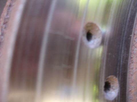 1990 Ford Taurus - Close-up of a worn brake rotor, indicating it is a vehicle part, not a specific model year.