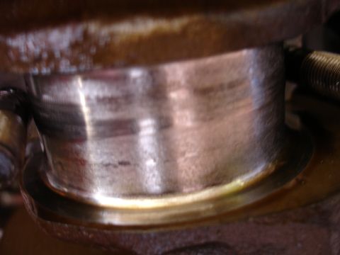 1992 Ford Taurus - This image shows a close-up view of a worn engine crankshaft bearing, indicating potential internal engine issues.