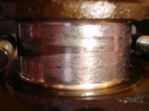 1992 Ford Taurus - A close-up view of a worn engine part, suggesting internal engine work.