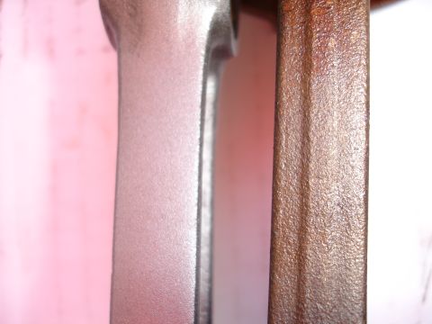 1992 Ford Taurus - Comparison of a refinished connecting rod next to a rusty one, likely for an engine rebuild project.