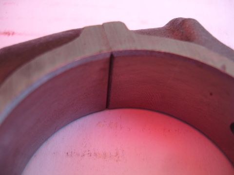 1992 Ford Taurus - A close-up view of a split engine bearing, showing wear and potential damage.