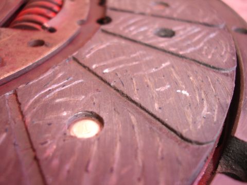 1992 Ford Taurus - A detailed view of a clutch disc, showing its textured surface and internal spring mechanism.
