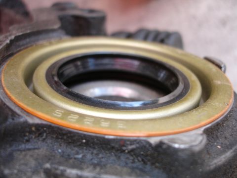 1992 Ford Taurus - A close-up view of an engine component, revealing a seal with embossed lettering.