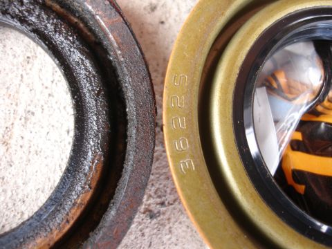 1992 Ford Taurus - Comparison of a worn engine seal next to a new one, revealing the part number 36225 on the replacement.