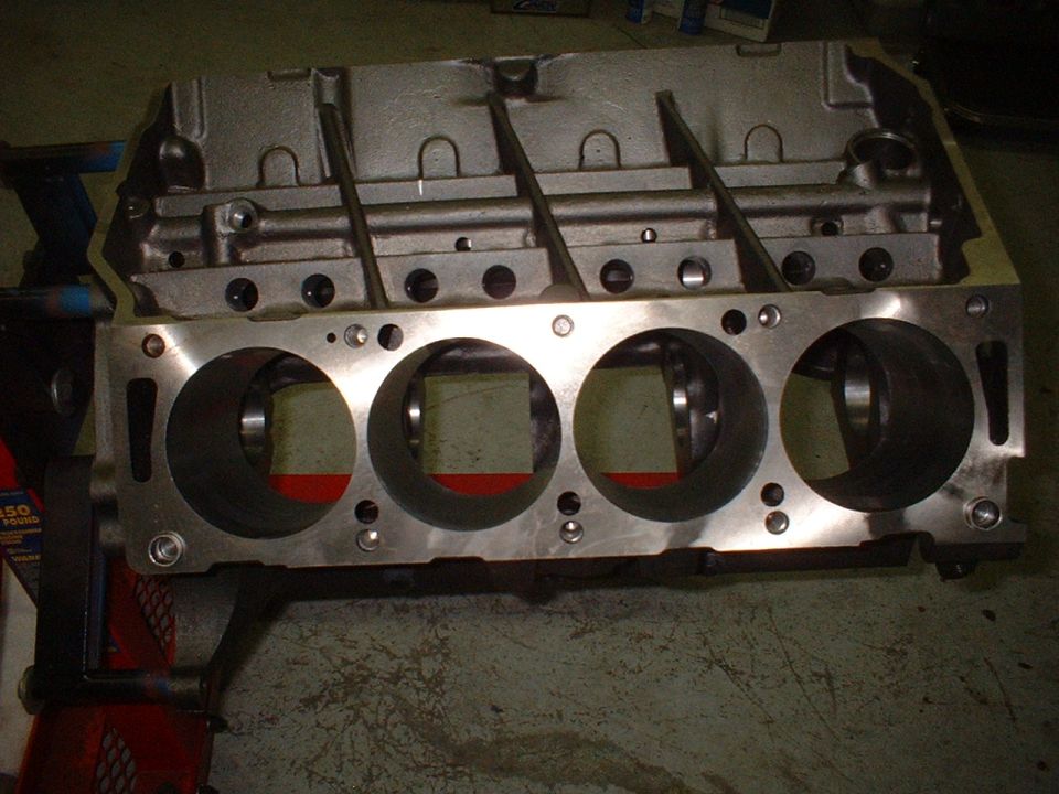 Engine block with four cylinders visible