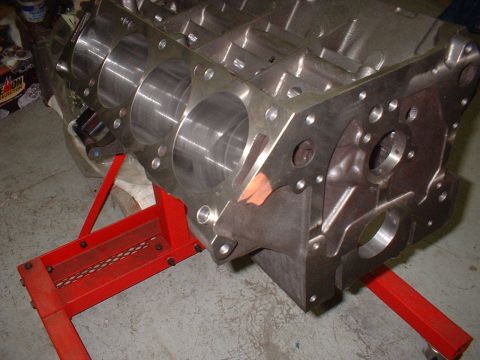 1968 Ford Galaxie - A bare engine block is mounted on a red stand, ready for assembly or inspection.