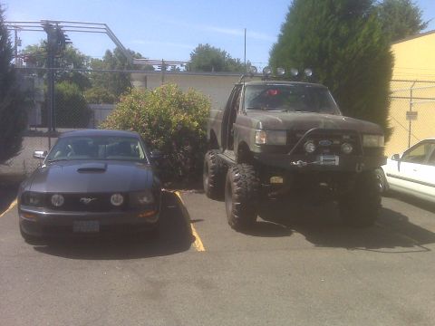1996 Ford Bronco - Mustang next to Bronco