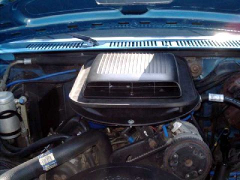 1984 Ford Bronco - scoop and top plate mounted to flat metal pan that is bolted to the air box, with a cutout for airflow