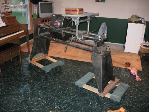1991 Ford Bronco - A woodworking lathe is shown on wheeled stands in a garage setting.