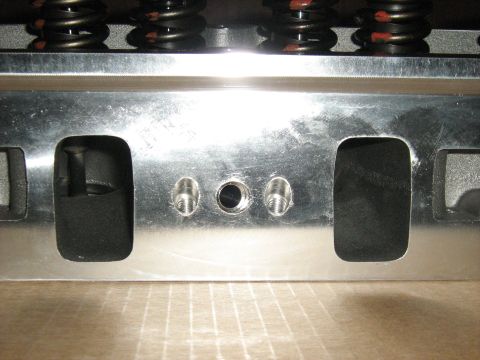 1988 Mercury Grand Marquis - Engine cylinder head with valve springs and bolt holes visible.