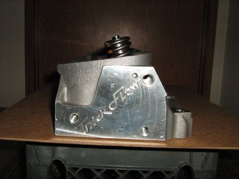 1988 Mercury Grand Marquis - Close-up of an aluminum engine component the 'Trick Flow' branding and a '35' designation.