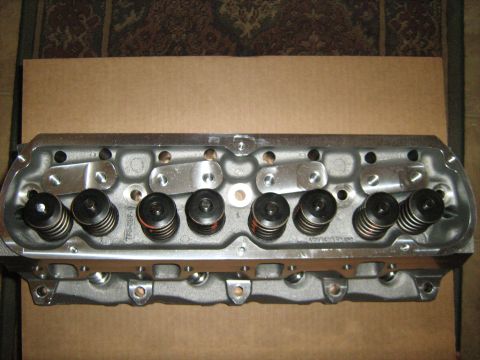1988 Mercury Grand Marquis - Close-up of an engine cylinder head, showing internal components like valves and springs.