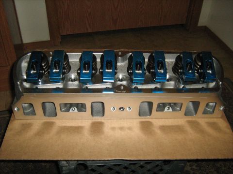 1988 Mercury Grand Marquis - Close-up of engine cylinder heads blue roller rockers, ready for installation.