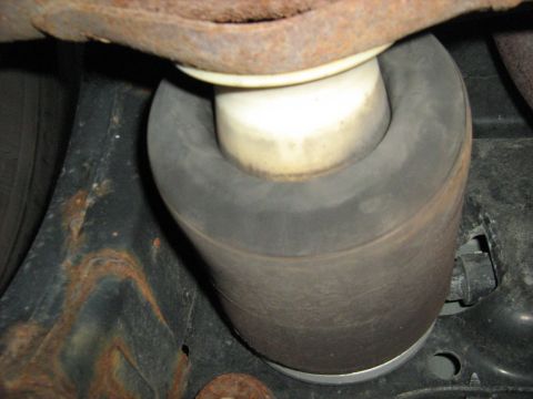 1988 Mercury Grand Marquis - This image shows a close-up view of an air suspension component, likely a bellows, on a vehicle.