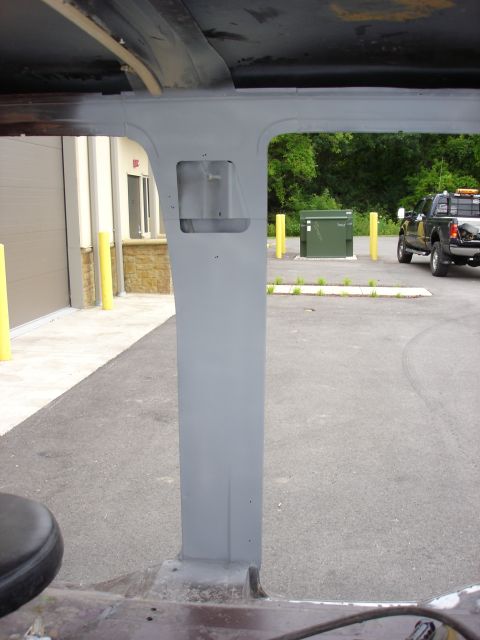 1979 Ford F-250 - Gray painted A-pillar inside a vehicle, with a pickup truck parked outside in the background.