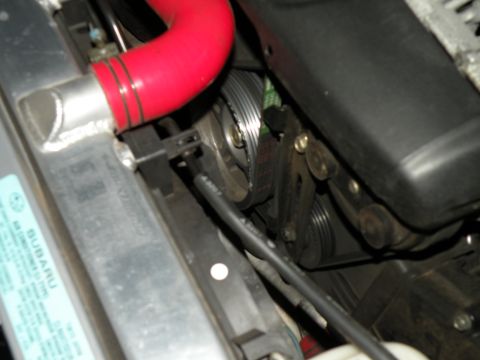 1998 Subaru Legacy - Engine bay detail showing the belt drive system and radiator components.