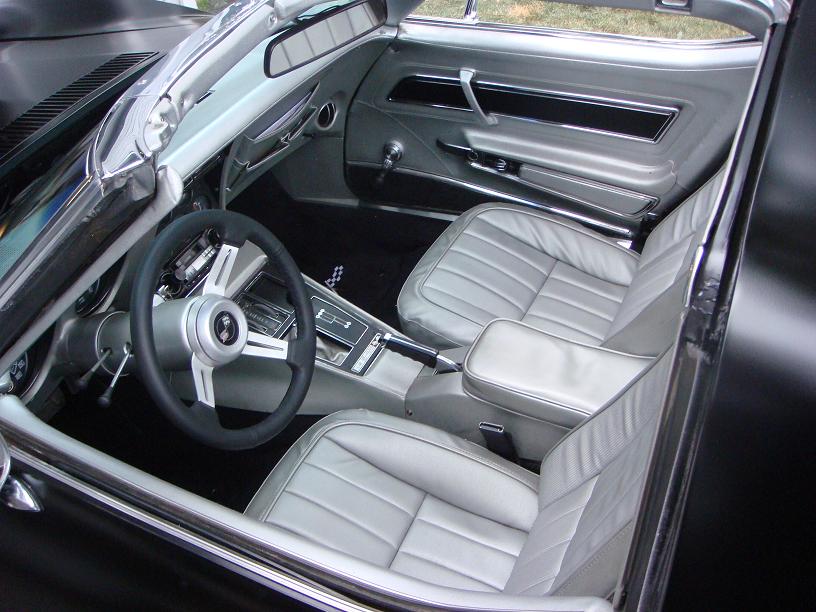 1975 Chevrolet Corvette interior with silver seats and dashboard