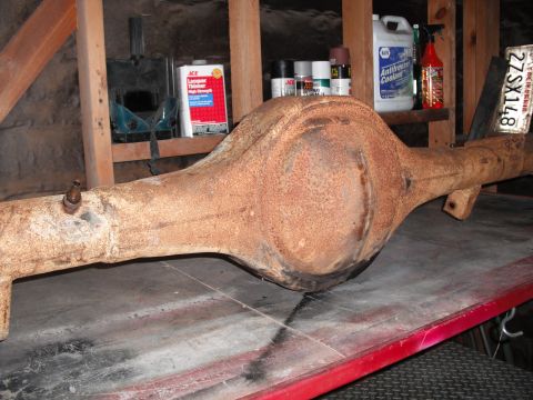 1991 Ford Bronco - A rusty rear axle assembly is shown, with a California license plate visible in the background.