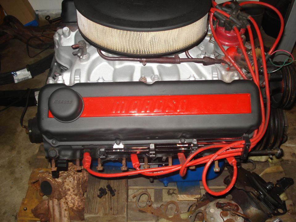 Engine with black and red Maroso valve covers, air filter, and red spark plug wires