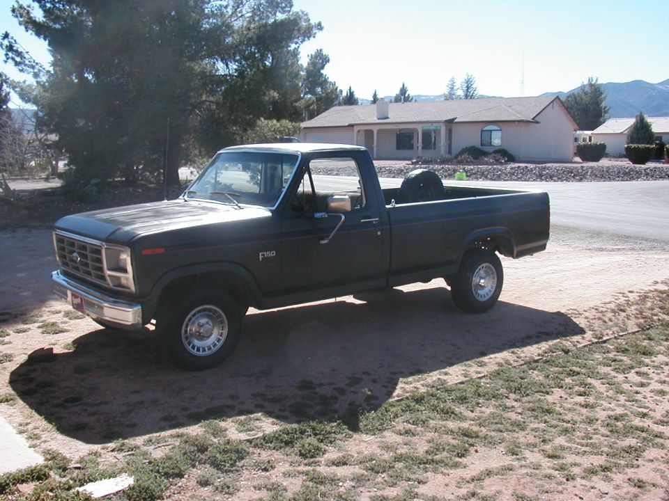 Ford F-150 pickup truck parked outside a house
