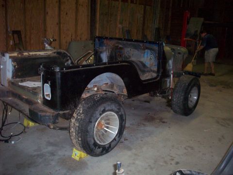 1978 Jeep CJ5 - A disassembled Jeep CJ-series body sits in a workshop, awaiting restoration.