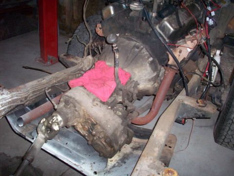 1978 Jeep CJ5 - The drivetrain of a Jeep CJ5 is shown, with the engine and transmission components visible.