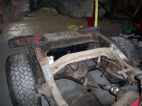1978 Jeep CJ5 - The frame and suspension components of a 1978 Jeep CJ5 are visible, including the rear axle and tires.