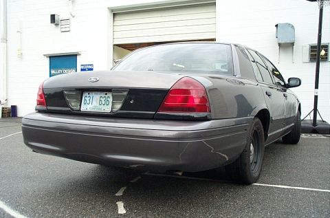 2001 Ford Crown Victoria - Rear view of a 2001 Ford Crown Victoria sedan parked outdoors.