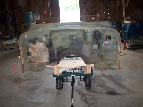 1978 Jeep CJ5 - This Jeep CJ firewall and cowl assembly is mounted on a dolly for transport or repair.