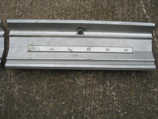 Aluminum car trim with the word FALCON embossed in capital letters