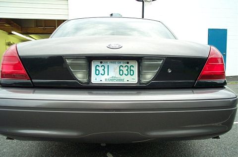 2001 Ford Crown Victoria - The rear of a Ford Crown Victoria is shown, a license plate from New Hampshire.