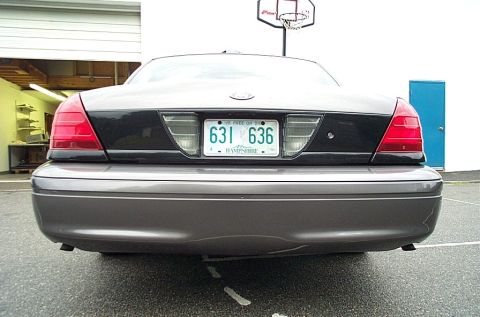 2001 Ford Crown Victoria - Rear view of a 2001 Ford Crown Victoria, showing its taillights and license plate.
