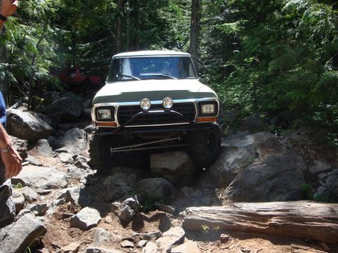 1978 Ford Bronco - A 1978 Ford Bronco tackles a challenging rocky off-road path.
