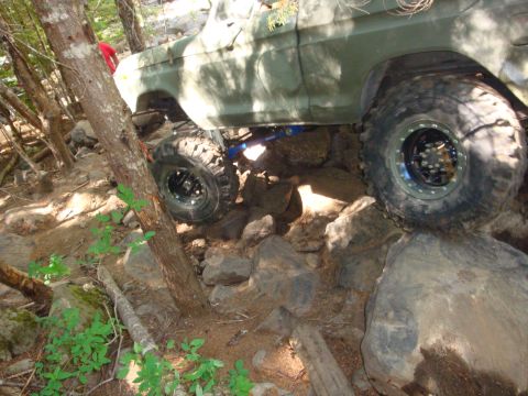 1978 Ford Bronco - A 1978 Ford Bronco tackles a challenging rocky trail with its large tires.