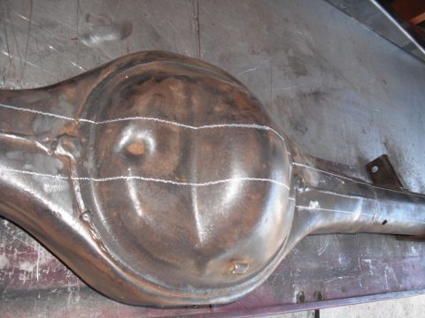 1991 Ford Bronco - Rear axle housing marked with chalk lines for modification work.