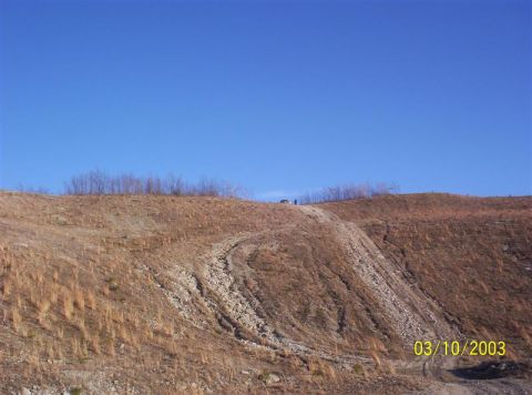 1992 Ford F-150 - Picture 3 of 4 of me climbing a hill on an old strip mine near where I live. I'm the black dot next to my truck. I'm about 6'1 so that kind…