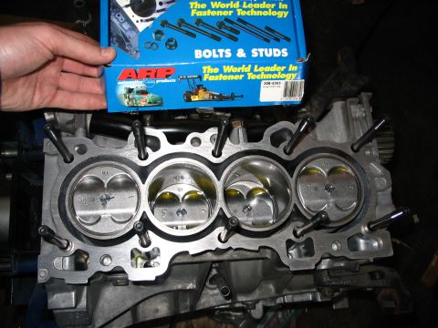 1994 Acura Integra - Engine block with pistons and a box of ARP bolts are visible in this close-up shot.