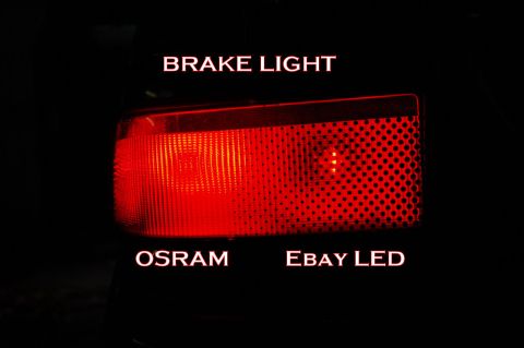 1985 Mercury Grand Marquis - Close-up of a red car taillight, labeled 'OSRAM' and 'EBAY LED'.