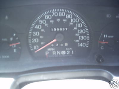1991 Ford Crown Victoria - Close-up of a car's dashboard gauges, including the odometer and speedometer.