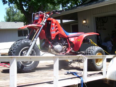 1991 Ford Bronco - A red three-wheeled ATV with "Fox" graphics is secured to a trailer.