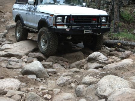 1978 Ford Bronco - This 1978 Ford Bronco is shown off-roading over a challenging rocky path.